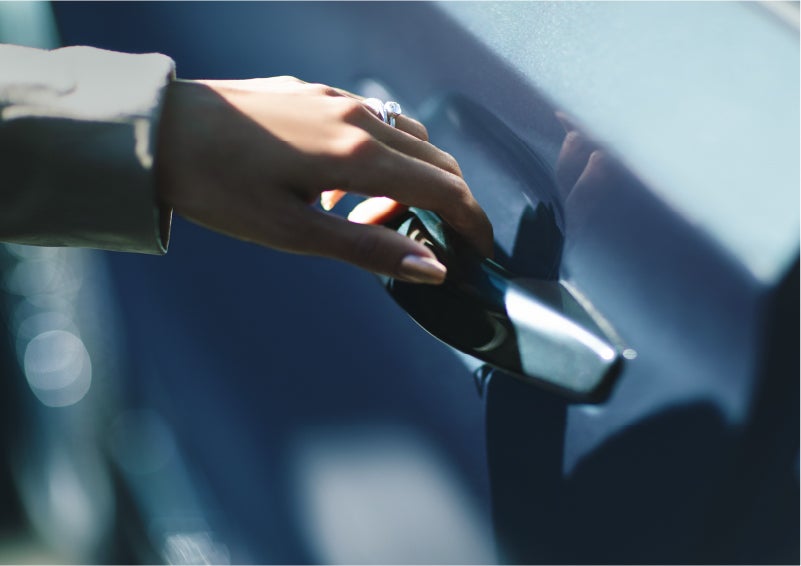 A hand gracefully grips the Light Touch Handle of a 2023 Lincoln Aviator® SUV to demonstrate its ease of use | Gary Yeomans Lincoln in Daytona Beach FL