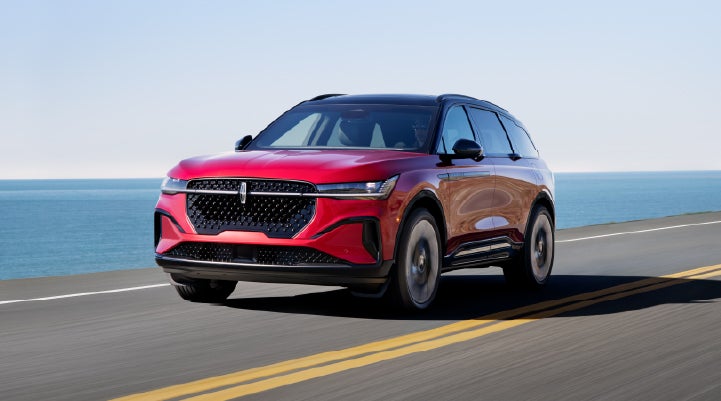 A 2025 Lincoln Nautilus® SUV is being driven on a seaside roadway. | Gary Yeomans Lincoln in Daytona Beach FL
