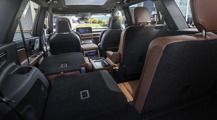 One side of the PowerFold® third-row seat and a second-row seat are folded forward in the 2026 Lincoln Aviator® SUV. | Gary Yeomans Lincoln in Daytona Beach FL