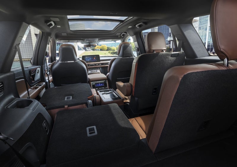 One side of the PowerFold® third-row seat and a second-row seat are folded forward in the 2026 Lincoln Aviator® SUV. | Gary Yeomans Lincoln in Daytona Beach FL