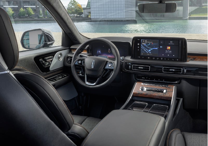 The interior of the 2026 Lincoln Aviator® SUV is shown parked with a view of a harbor through the windshield. | Gary Yeomans Lincoln in Daytona Beach FL