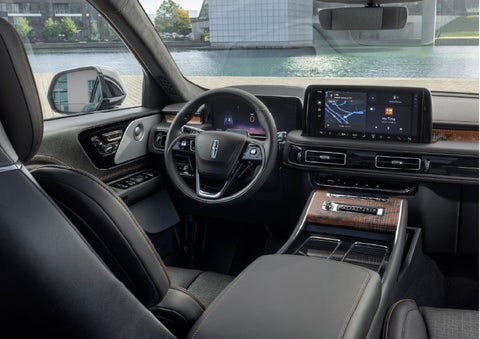 The interior of the 2026 Lincoln Aviator® SUV is shown parked with a view of a harbor through the windshield. | Gary Yeomans Lincoln in Daytona Beach FL