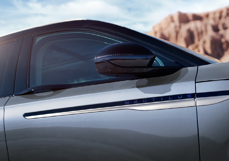 Blue lettering on the side of the vehicle that reads Nautilus indicates the available Hybrid Powertrain. | Gary Yeomans Lincoln in Daytona Beach FL