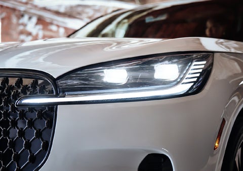A close-up of a headlamp on the 2027 Lincoln Aviator® SUV is shown. | Gary Yeomans Lincoln in Daytona Beach FL