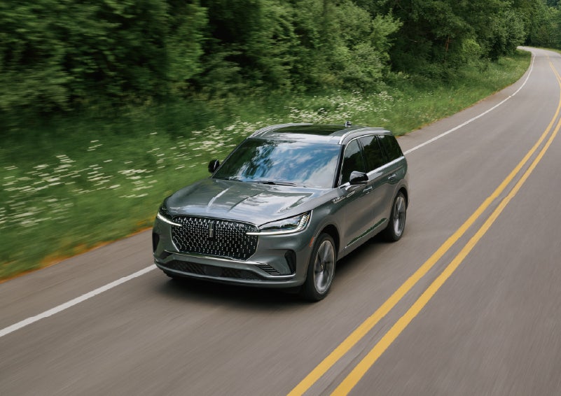 A 2027 Lincoln Aviator® SUV is being driven down a road. | Gary Yeomans Lincoln in Daytona Beach FL