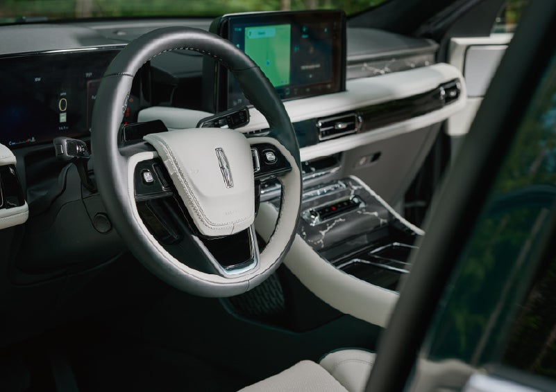 The leather-trimmed steering wheel of a 2027 Lincoln Aviator® Black Label™ SUV. | Gary Yeomans Lincoln in Daytona Beach FL